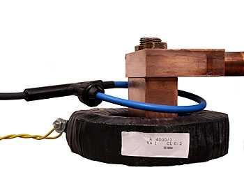 Flexible clip-around, RCT1A sense coil and a bulky fixed core metering current transformer both 4000A rated primary